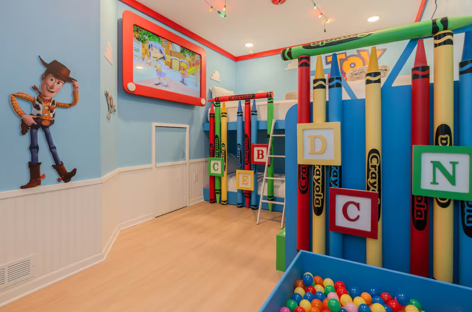 Toy Story themed kids bunk room with ball pit near Disney, designed by Juliana Becca
