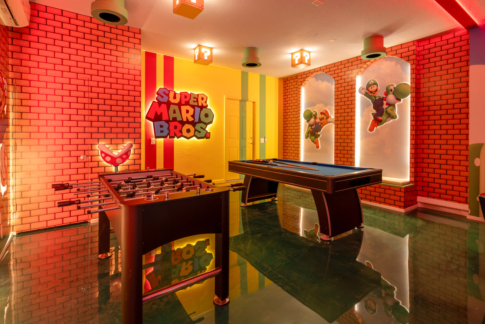 Super Mario themed game room with foosball and pool table in a Central Florida vacation rental