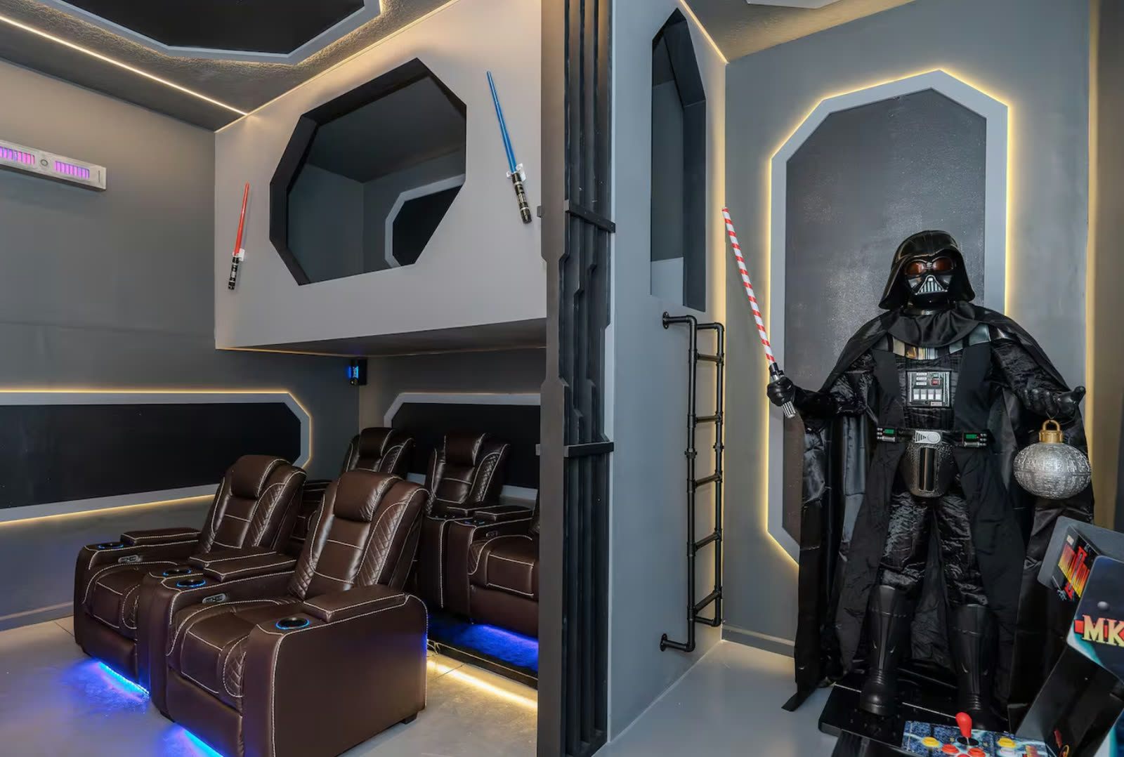 Star Wars themed home theater with recliner seating in an Orlando vacation home designed by Juliana Becca