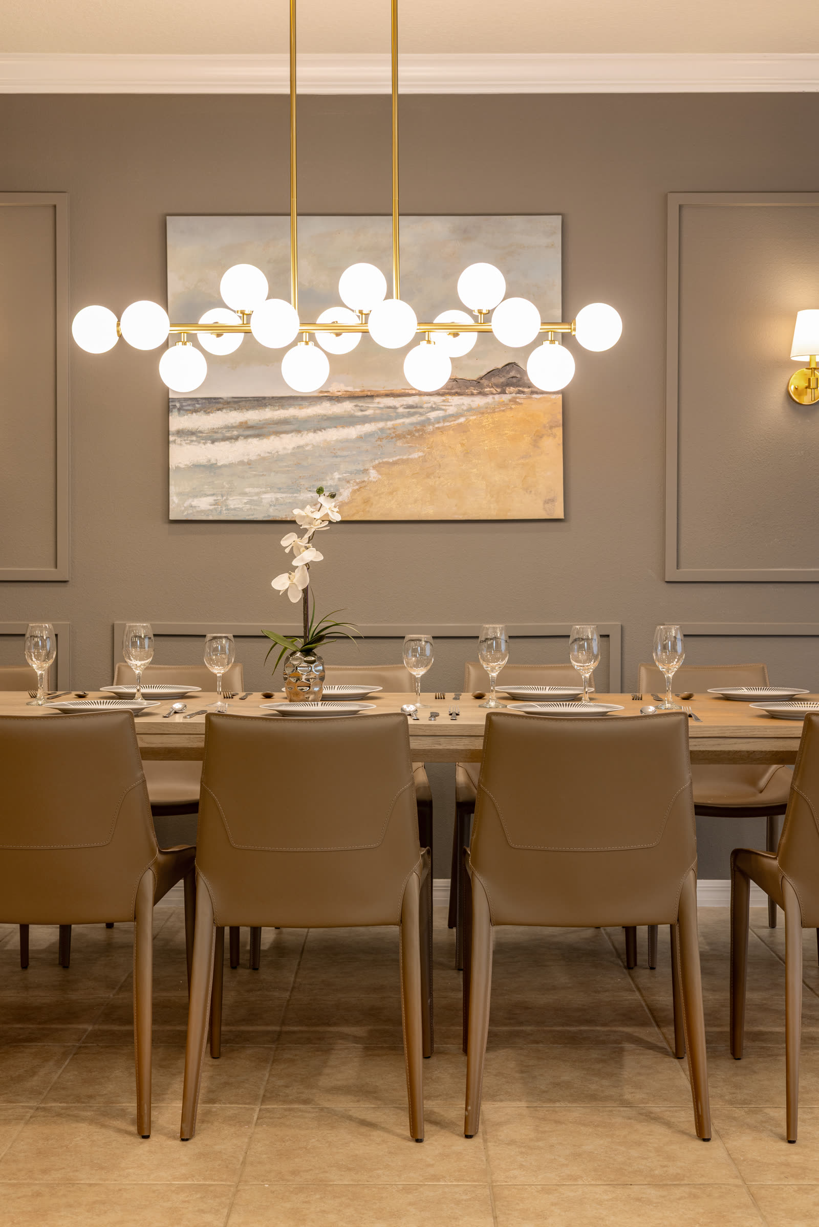 Elegant dining room with modern chandelier in a luxury Orlando residential interior design project